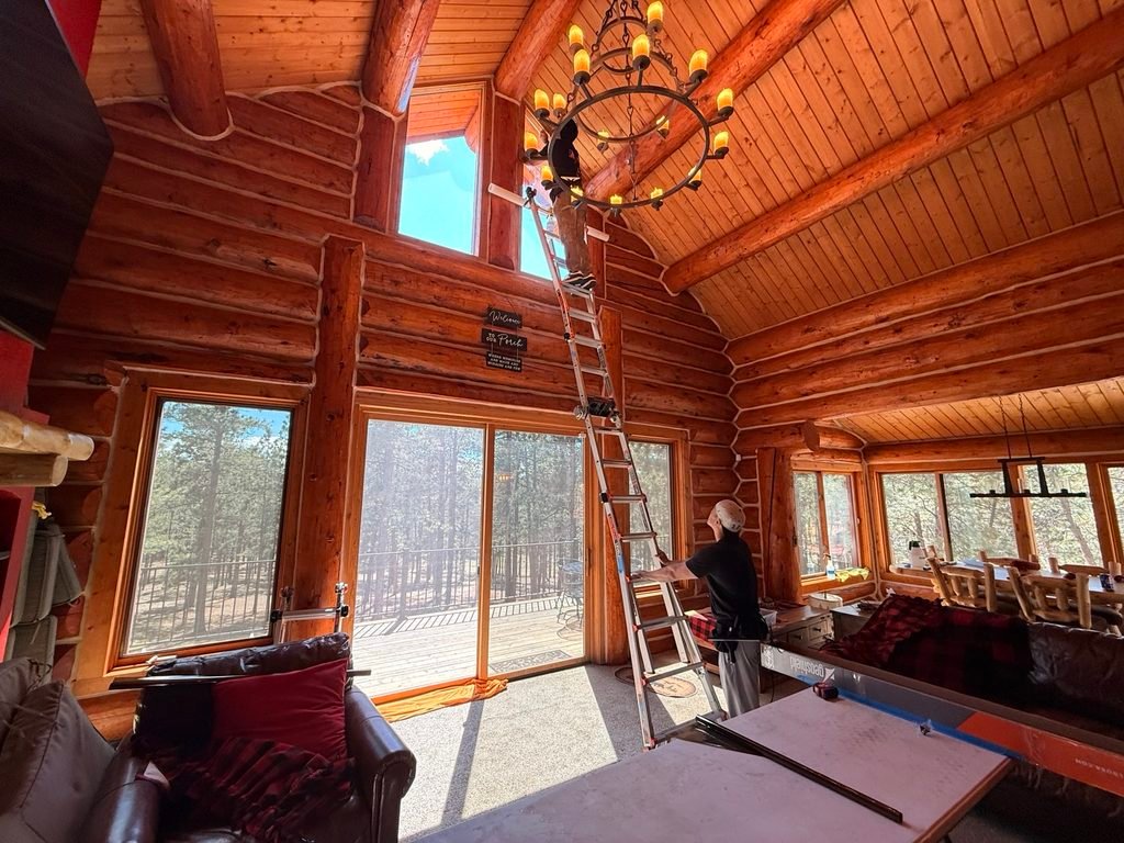 Tinting large windows inside a log cabin