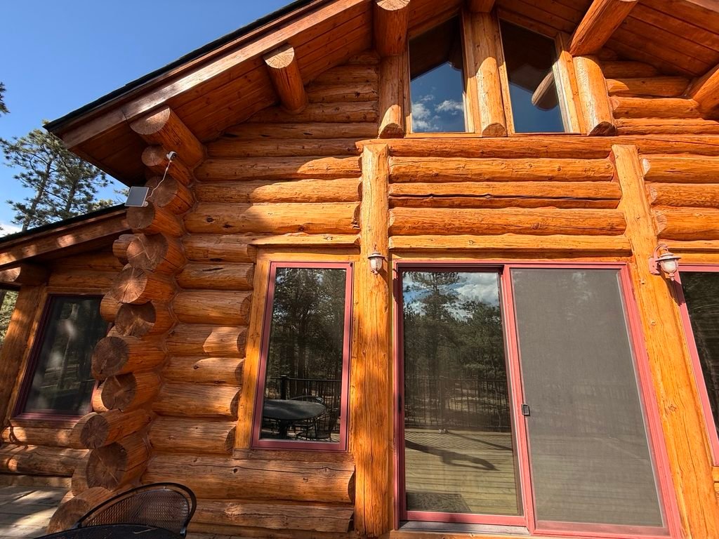 Log cabin windows viewed from outside